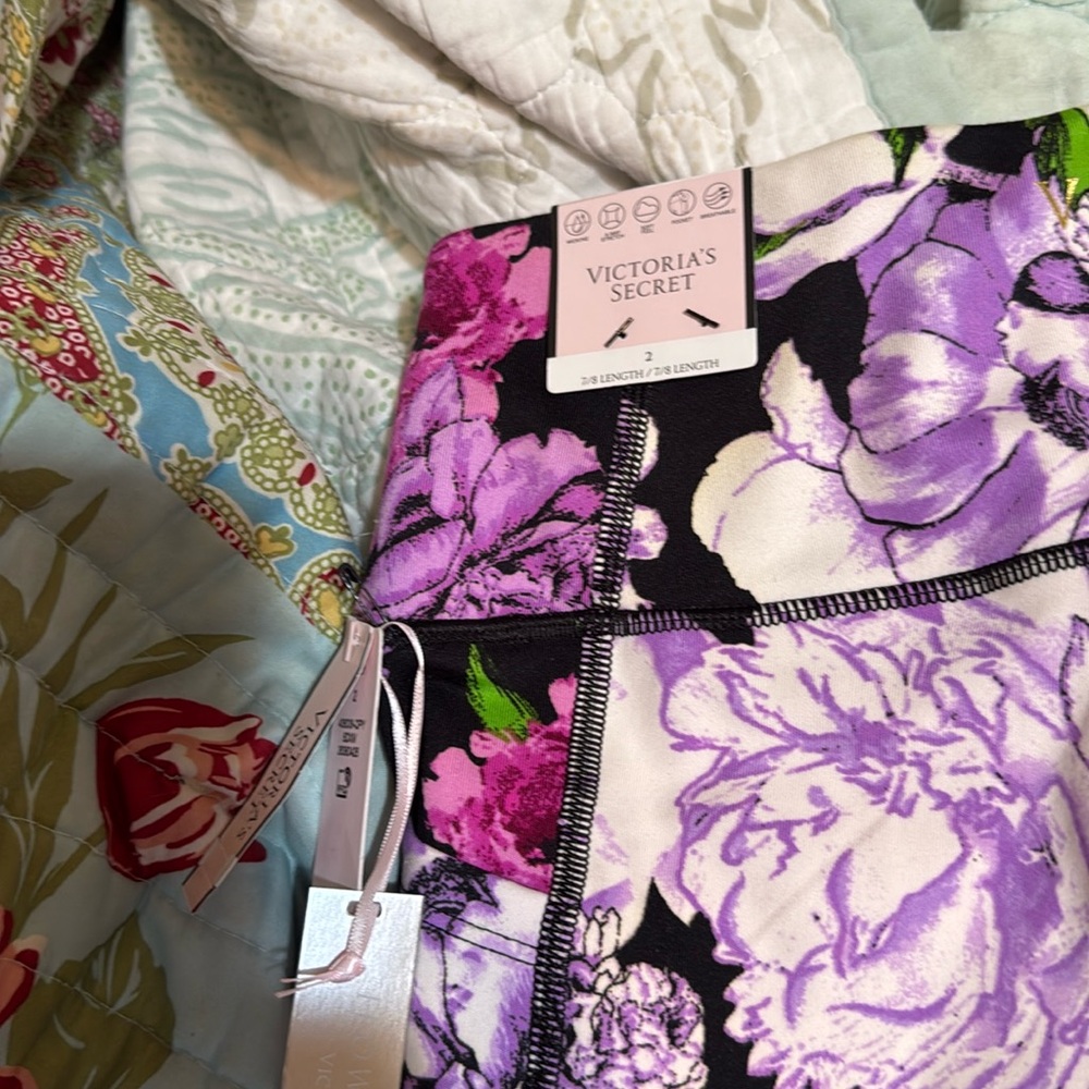 Size 2, Victoria’s Secret leggings, black with purple and white flowers
